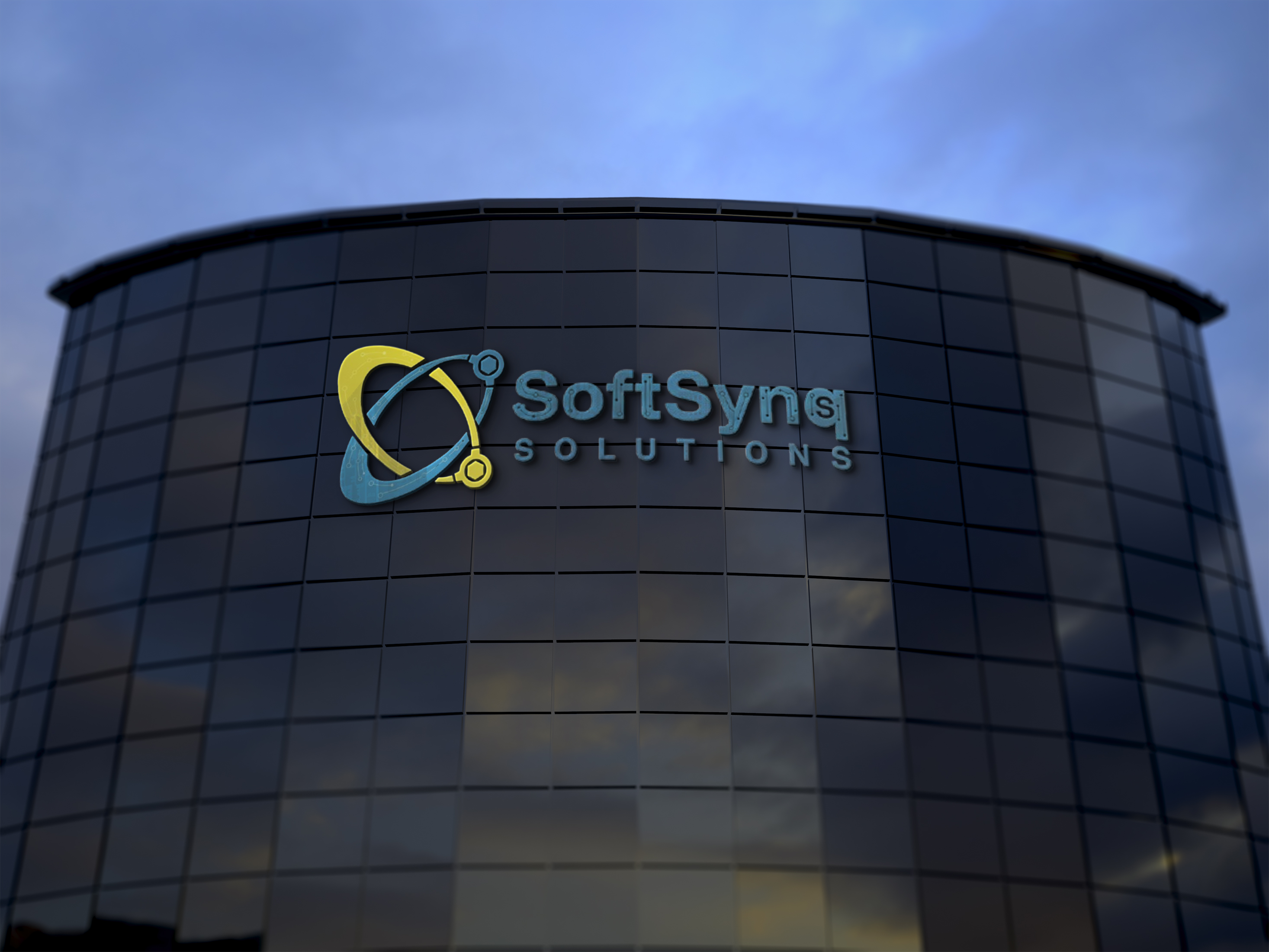 SoftSynq Solutions sign on a modern glass building